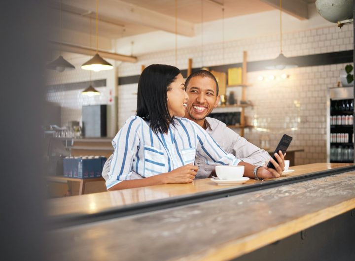 Couple phone selfie, love and cafe date in coffee shop or restaurant and bonding, enjoying free tim